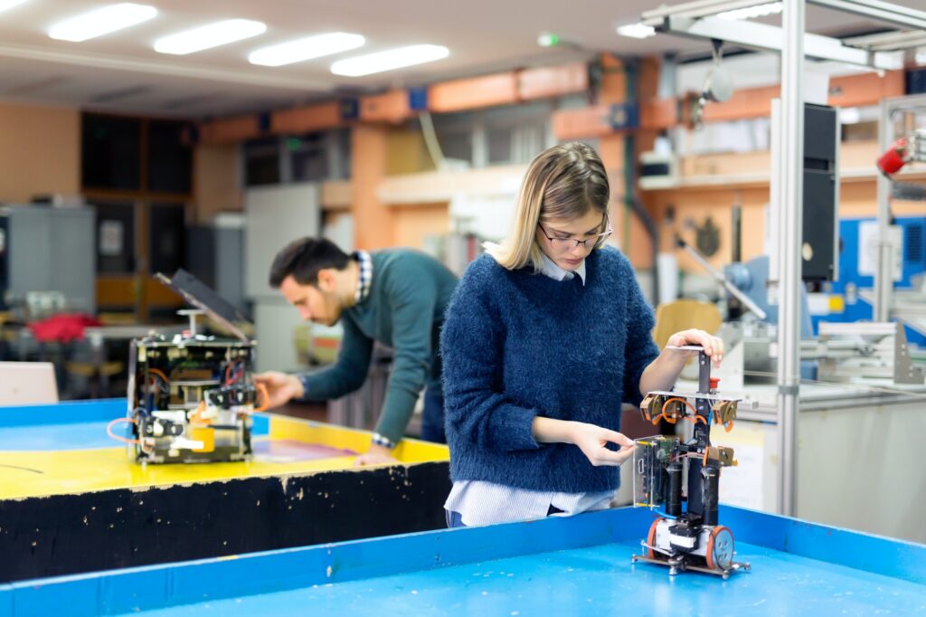 Young woman engineer working on robotics project